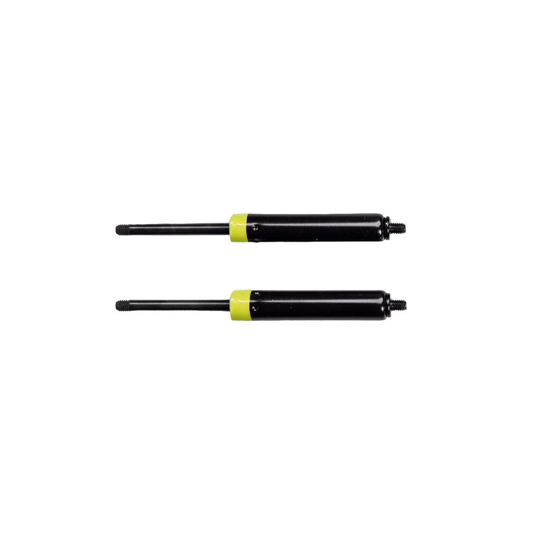 Two black gas springs (gas struts) with threaded rod ends and yellow collars, arranged horizontally on a white background. Cylindrical black bodies with slim black piston rods ending in threaded tips, showing light signs of use. Clean studio lighting with minimal shadows.