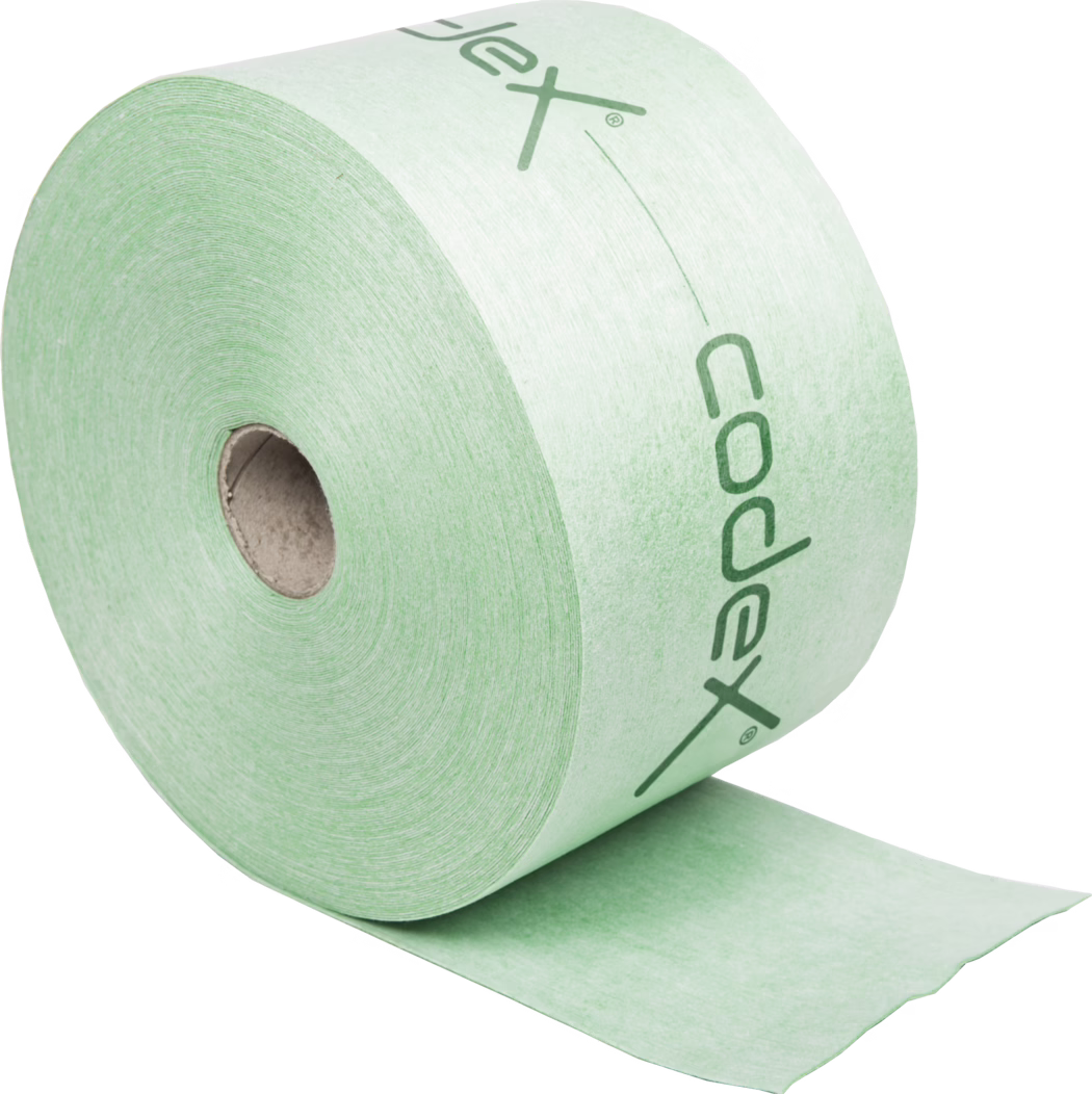 codex_Dummy_Dichtband_2018-12 Close-up of a large mint-green toilet paper roll with a cardboard core, visible spiral layers and part of a printed logo, showing the paper's texture and a partially unrolled sheet.